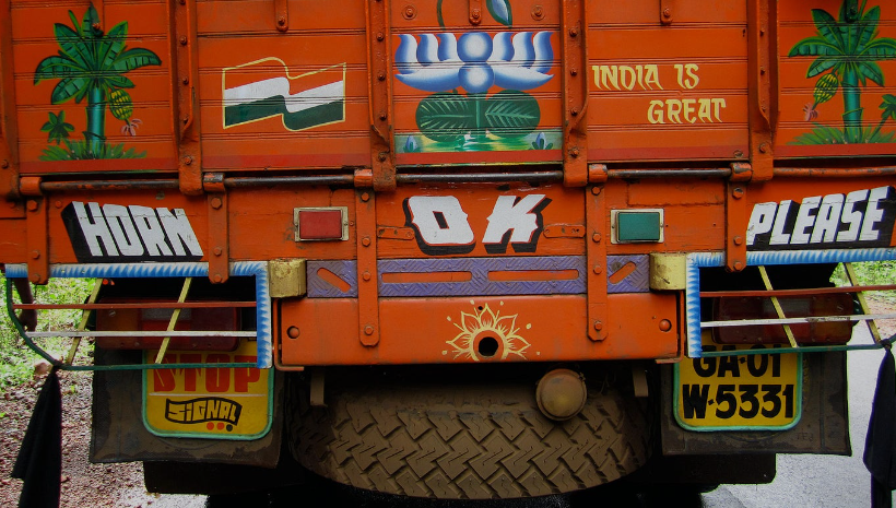 Horn Please is common and is Okay in India